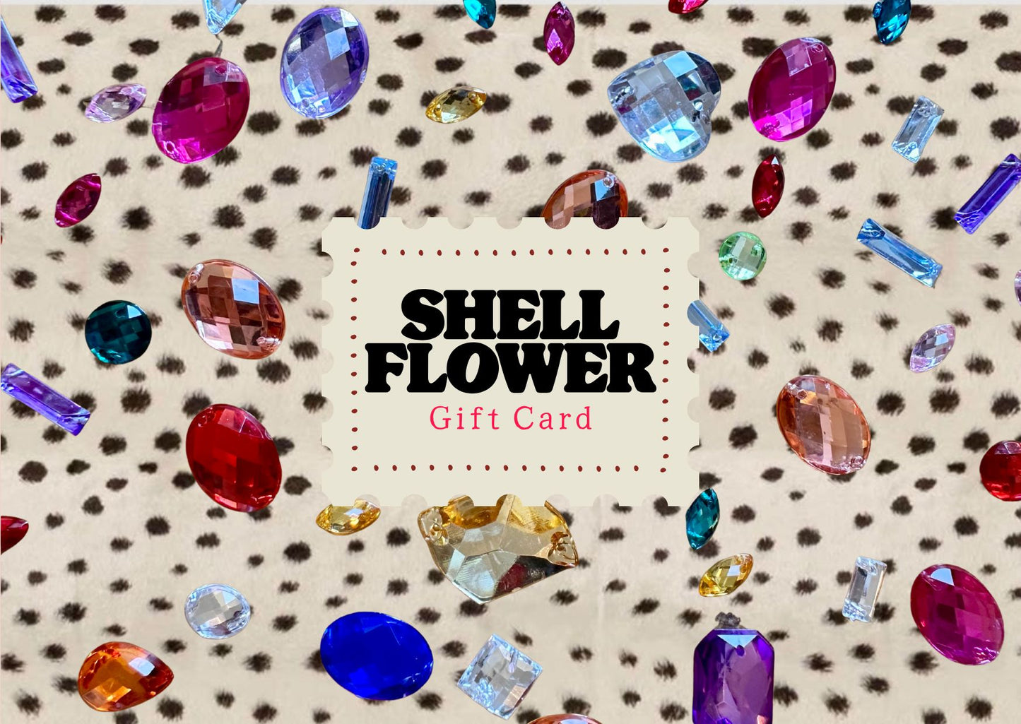 A Shell Flower gift card centered on a beige leopard-print background scattered with colorful faceted gemstones. The card reads 'SHELL FLOWER Gift Card' in black and pink text.